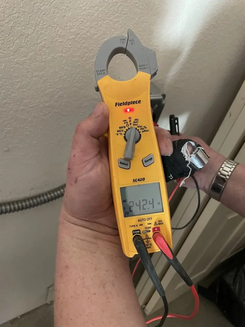 Voltage testing with clamp meter during Outlet Installation in North Hampton